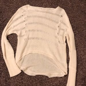 Knit sweater with see through cut outs